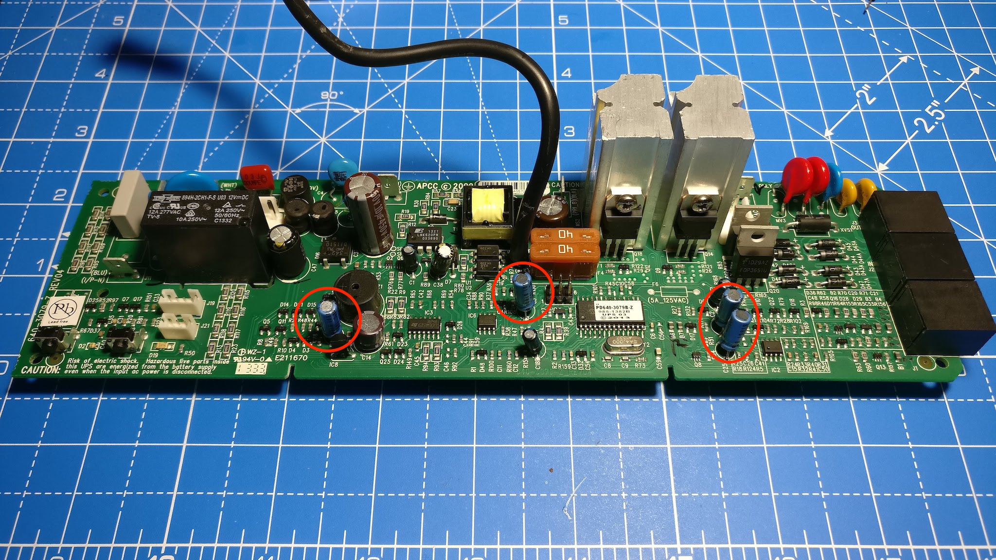 Picture showing circles around the capacitors that I've changed